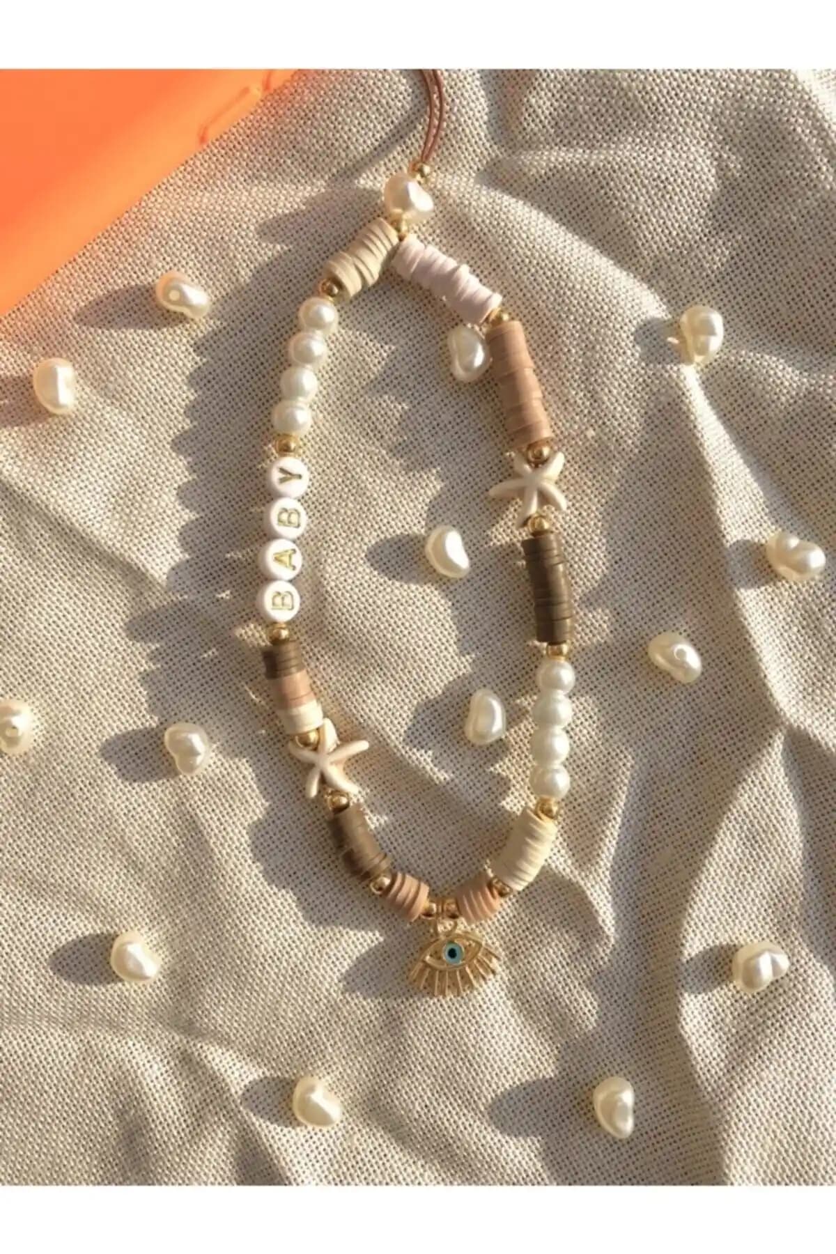 Moshi Design Fimo Boncuk Telefonn Askısı: Şık ve Kullanışlı Apple Telefon Aksesuarı